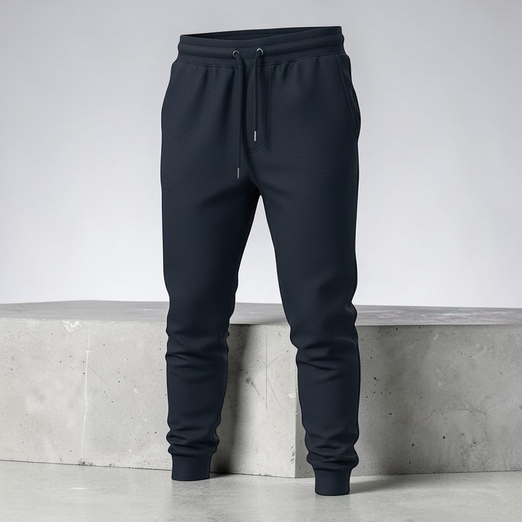 Gooxit navy blue 100% cotton unisex joggers with a relaxed fit, tapered leg, and ribbed waistband and cuffs.